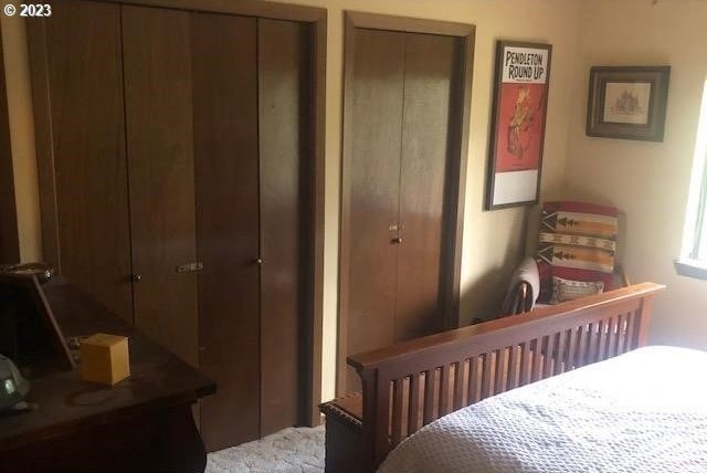 bedroom featuring two closets