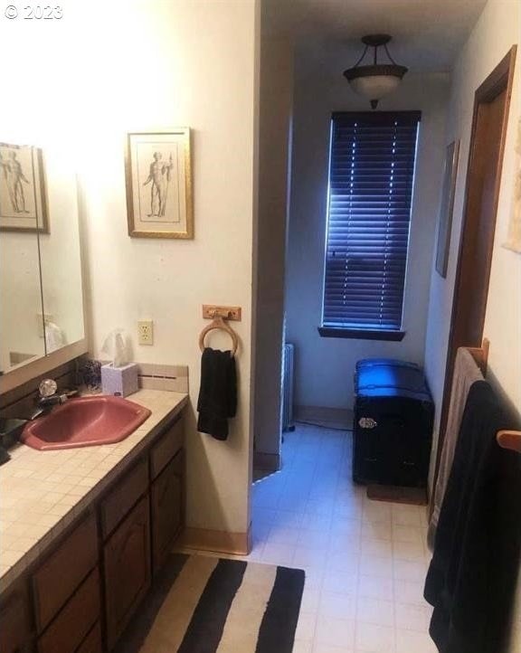 bathroom featuring vanity and radiator