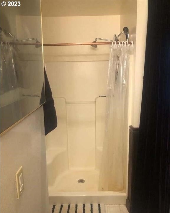 bathroom featuring a shower with curtain