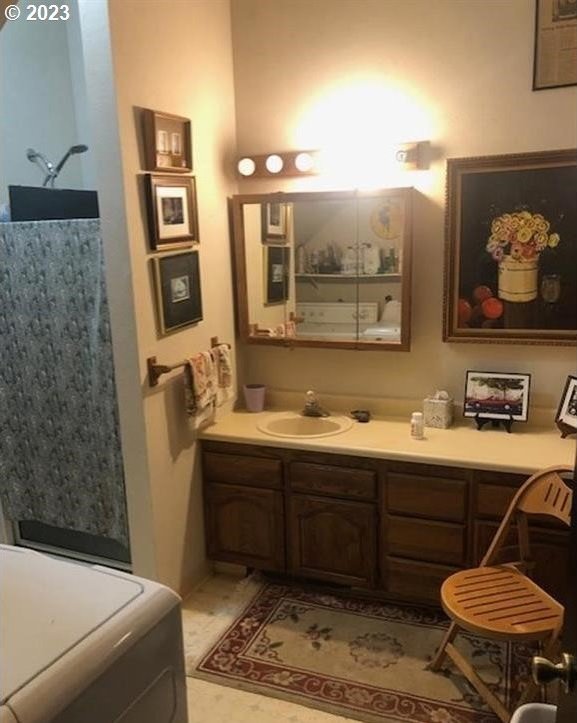 bathroom featuring tile patterned flooring and vanity