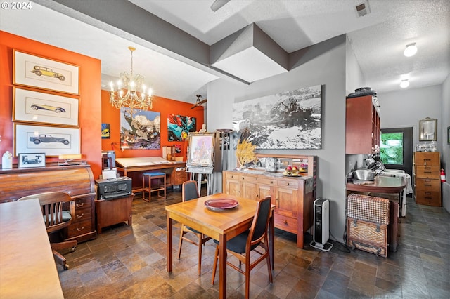 dining room with a textured ceiling and an inviting chandelier