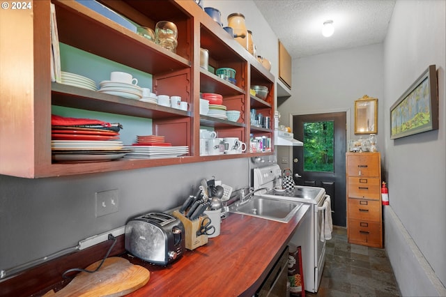 office featuring sink and a textured ceiling