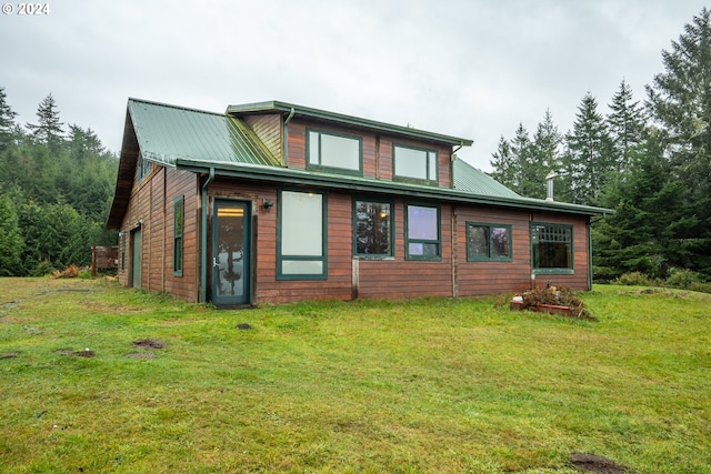 rear view of house with a lawn