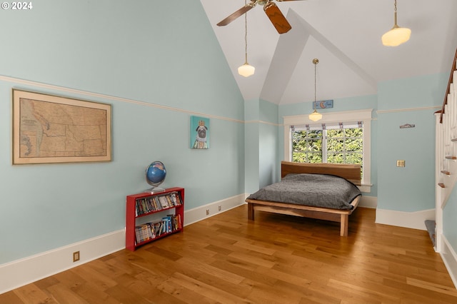 bedroom featuring ceiling fan, baseboards, high vaulted ceiling, and wood finished floors