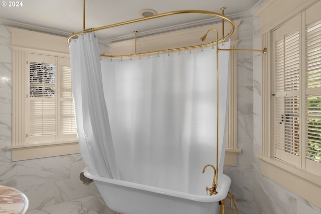 bathroom featuring a soaking tub, marble finish floor, and a shower with shower curtain