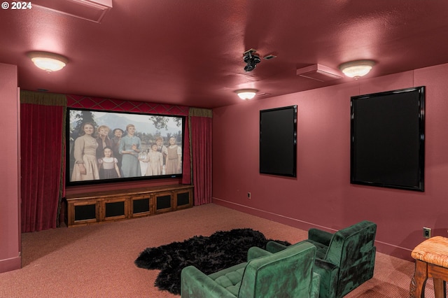 home theater room with carpet and a textured ceiling