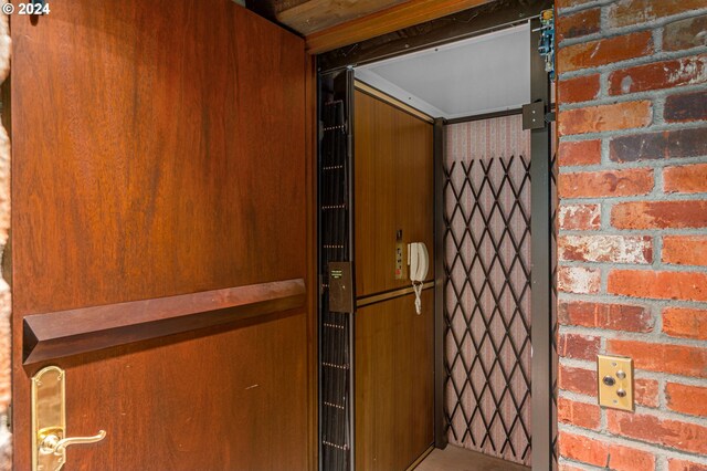 garage featuring a garage door opener and white refrigerator