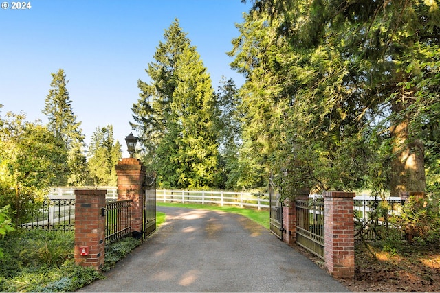 view of gate with fence