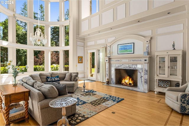 sunroom / solarium featuring a fireplace