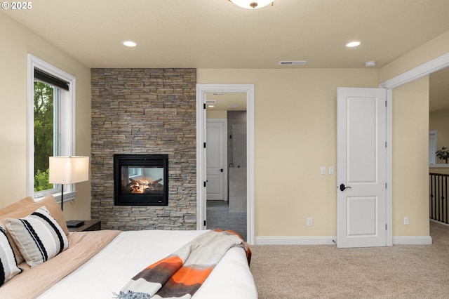 4425 SW 47th Dr, Portland, OR 97221 - bedroom featuring carpet flooring, a stone fireplace, and baseboards