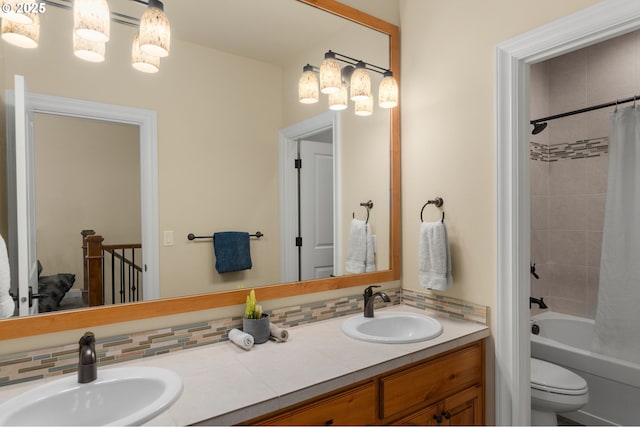 4425 SW 47th Dr, Portland, OR 97221 - full bathroom with double vanity, shower / tub combo with curtain, toilet, and tasteful backsplash