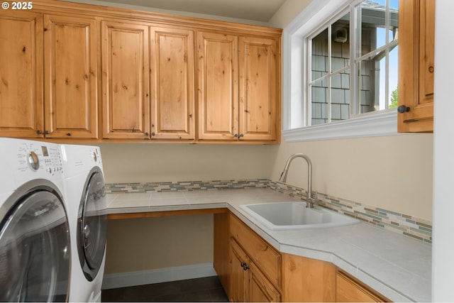 4425 SW 47th Dr, Portland, OR 97221 - laundry room featuring cabinet space, separate washer and dryer, and dark tile patterned flooring