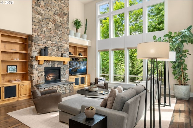 4425 SW 47th Dr, Portland, OR 97221 - living room featuring a high ceiling, wood-type flooring, and a fireplace