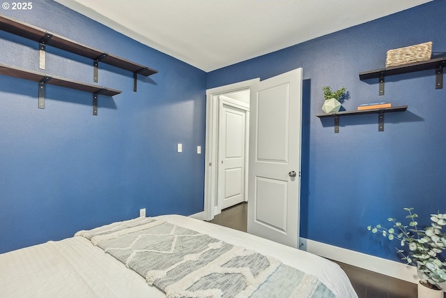 bedroom featuring baseboards