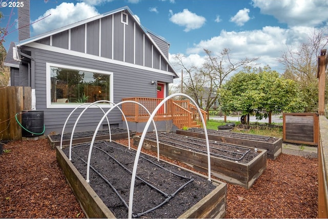 exterior space featuring a garden and central AC unit