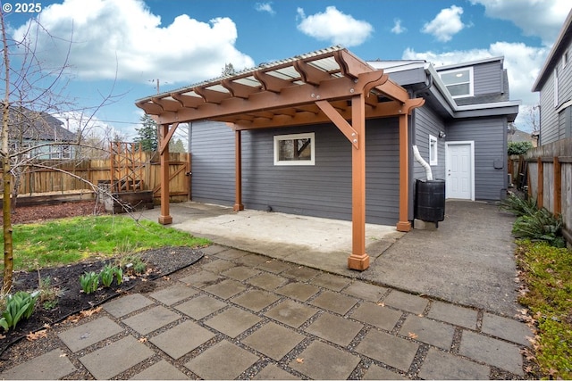 view of patio with a fenced backyard and a pergola