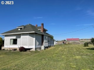 view of side of home featuring a yard