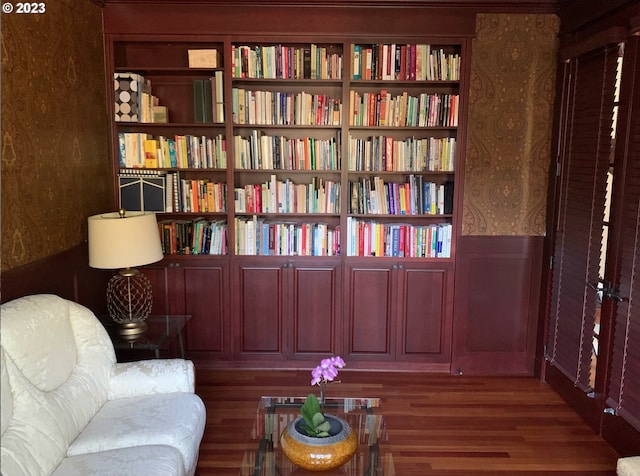 sitting room with dark hardwood / wood-style flooring