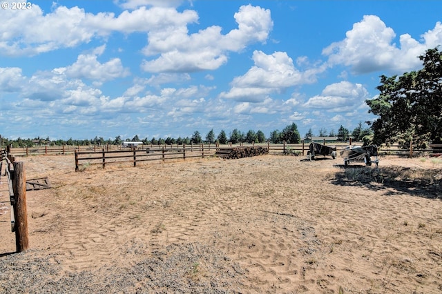 view of yard with a rural view