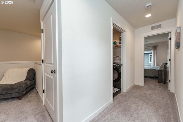11492 SE Mt Talbert Ave, Happy Valley, OR 97086 - hall with light carpet, washer / dryer, baseboards, and recessed lighting