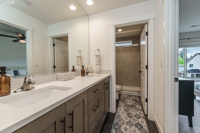 11492 SE Mt Talbert Ave, Happy Valley, OR 97086 - bathroom featuring ensuite bathroom, vanity, a stall shower, toilet, and ceiling fan