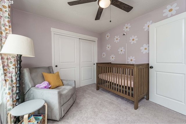 11492 SE Mt Talbert Ave, Happy Valley, OR 97086 - bedroom featuring a closet, carpet floors, a nursery area, wallpapered walls, and ceiling fan