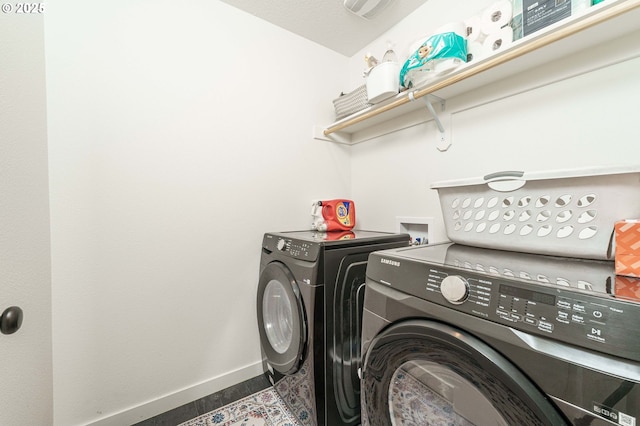 11492 SE Mt Talbert Ave, Happy Valley, OR 97086 - laundry room featuring separate washer and dryer and baseboards
