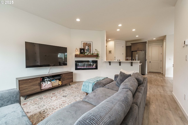 11492 SE Mt Talbert Ave, Happy Valley, OR 97086 - living area featuring recessed lighting, light wood-type flooring, baseboards, and a glass covered fireplace