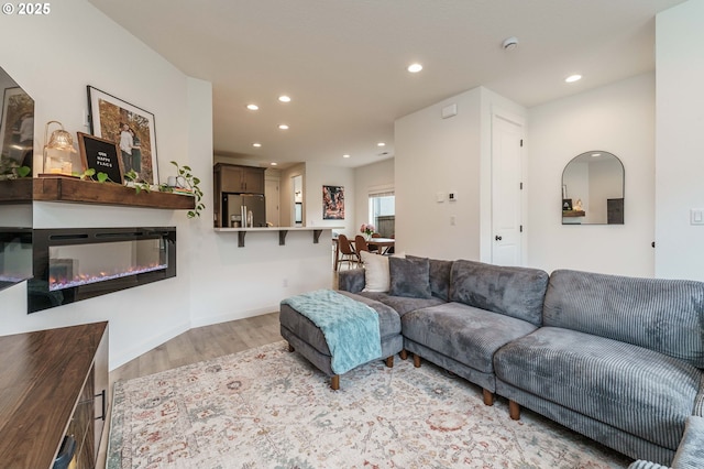 11492 SE Mt Talbert Ave, Happy Valley, OR 97086 - living area with light wood-style floors, recessed lighting, and a glass covered fireplace