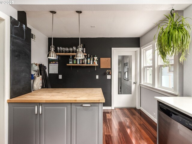 1405 NE 47th Ave, Portland, OR 97213 - kitchen featuring stainless steel dishwasher, butcher block countertops, dark wood finished floors, and pendant lighting