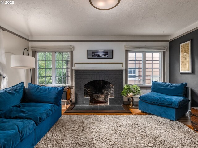 1405 NE 47th Ave, Portland, OR 97213 - living room with a textured ceiling, wood finished floors, and a fireplace