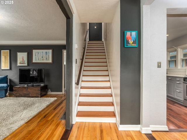 1405 NE 47th Ave, Portland, OR 97213 - stairs featuring wood finished floors and a textured ceiling