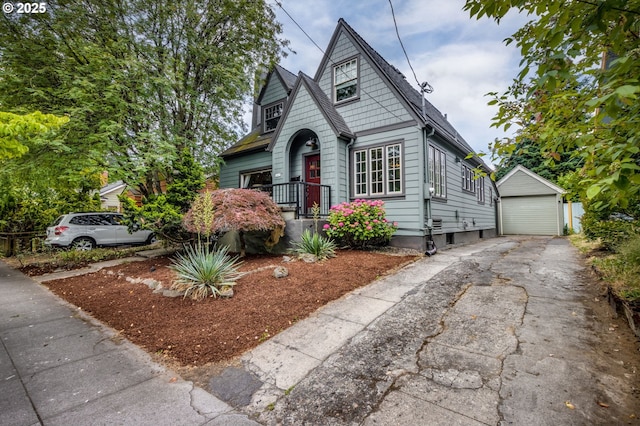 1405 NE 47th Ave, Portland, OR 97213 - bungalow-style house with an outbuilding, driveway, and a garage
