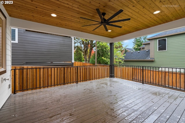 wooden deck featuring ceiling fan