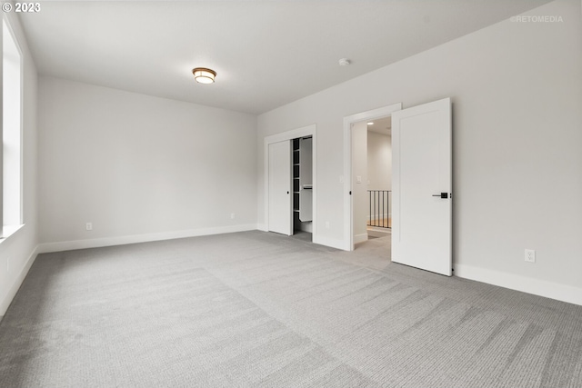 spare room with light colored carpet