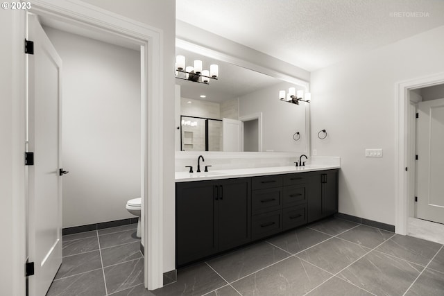 bathroom with double sink vanity, tile flooring, and toilet