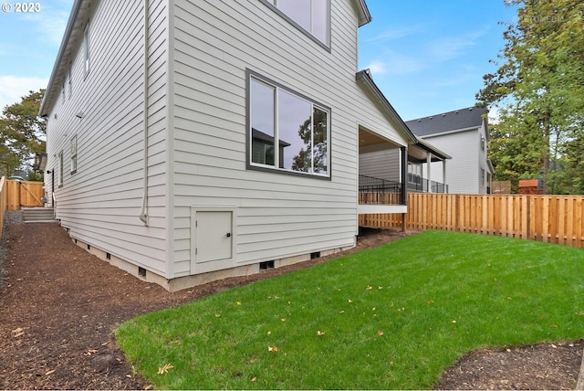 view of property exterior featuring a lawn