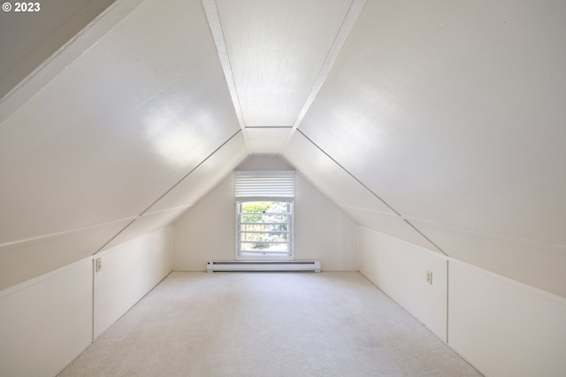 bonus room featuring a baseboard radiator, vaulted ceiling, and light colored carpet