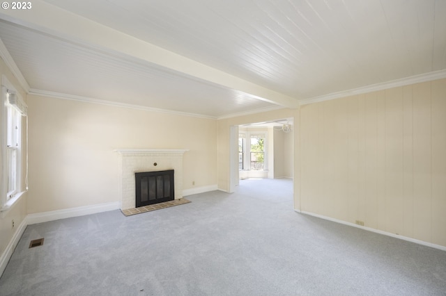 unfurnished living room featuring a brick fireplace, beam ceiling, and light carpet