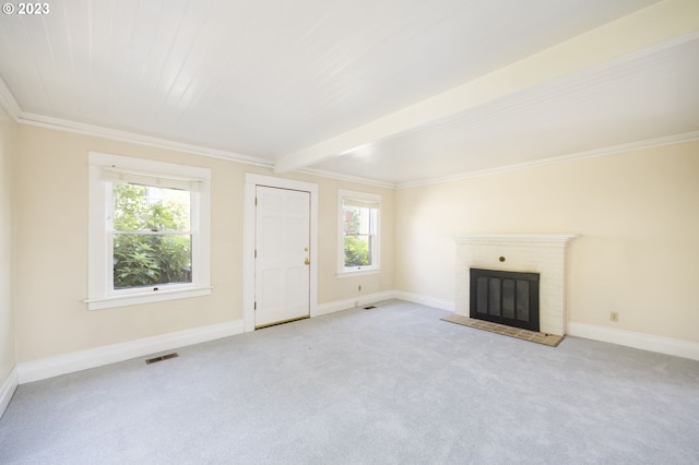 unfurnished living room featuring light carpet, beamed ceiling, crown molding, and a brick fireplace