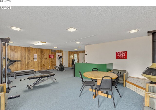 recreation room featuring a textured ceiling