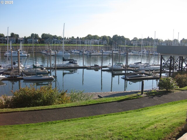 birds eye view of property with a water view