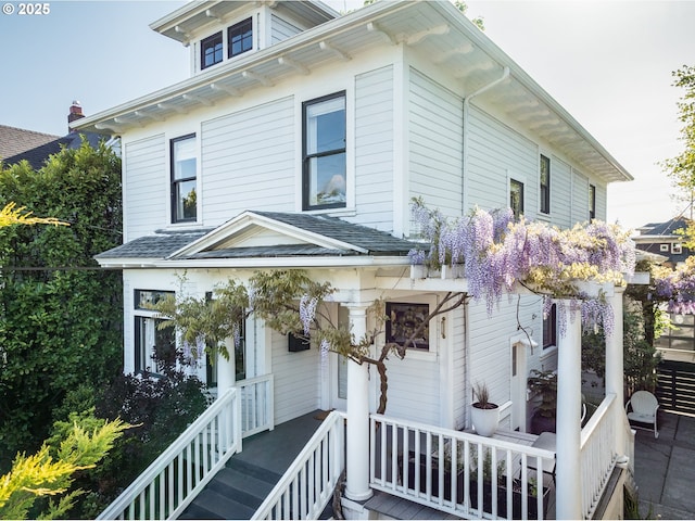 view of front of property with roof with shingles