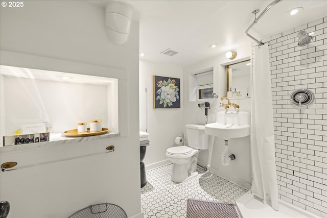 bathroom with toilet, tile patterned floors, visible vents, and a shower stall