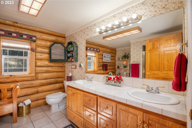 bathroom with plenty of natural light, toilet, log walls, and double sink vanity