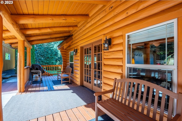 wooden deck featuring area for grilling