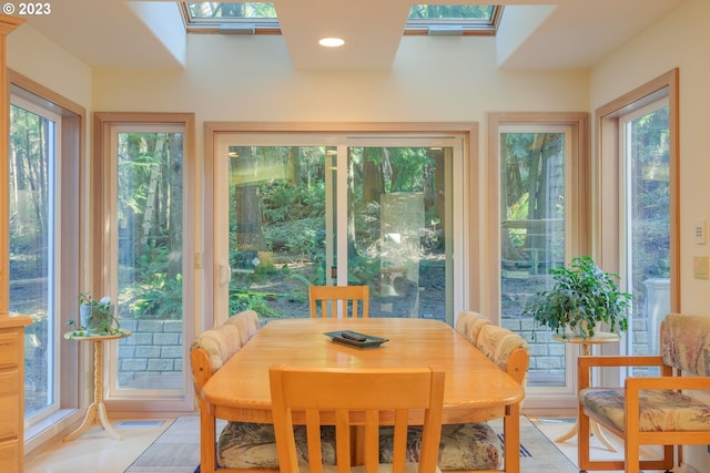 dining room with a skylight