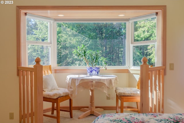 dining area featuring light carpet