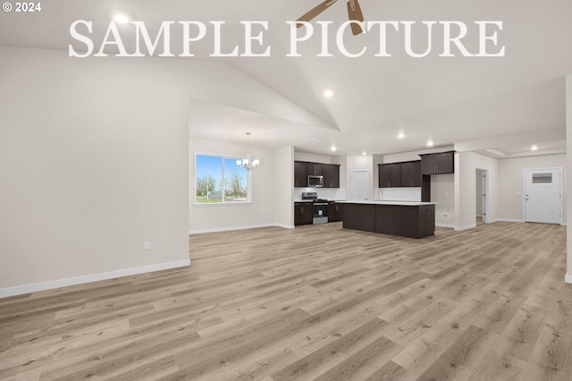 unfurnished living room featuring sink, wood-type flooring, lofted ceiling, and a notable chandelier