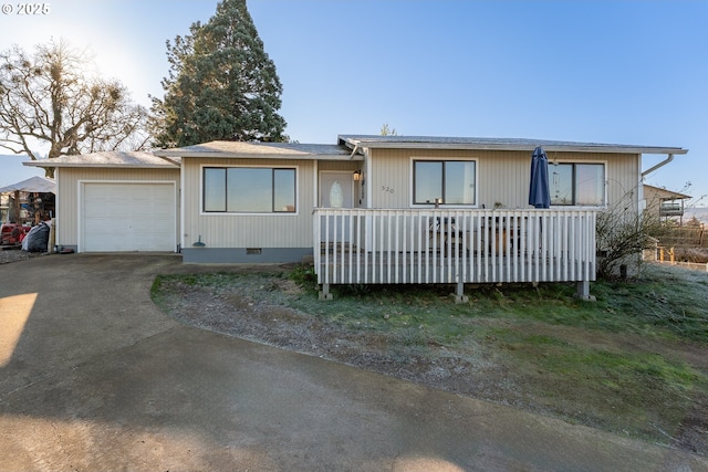 single story home featuring a garage